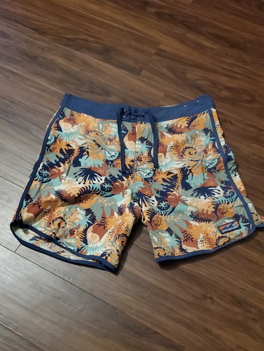 Patagonia Men’s Tropical Print Swim Shorts in Navy, Orange, Teal, and Tan
